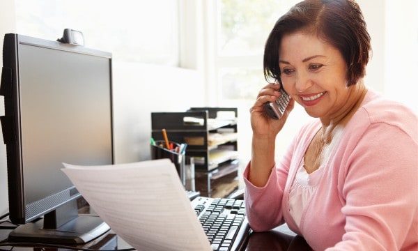 Woman happy with earnings with ATHome agency.